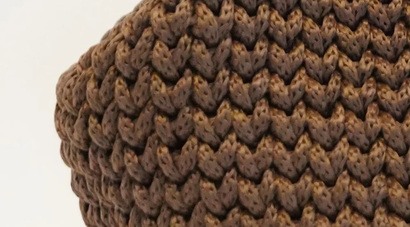 Close detail of chunky hand-crocheted stitchwork